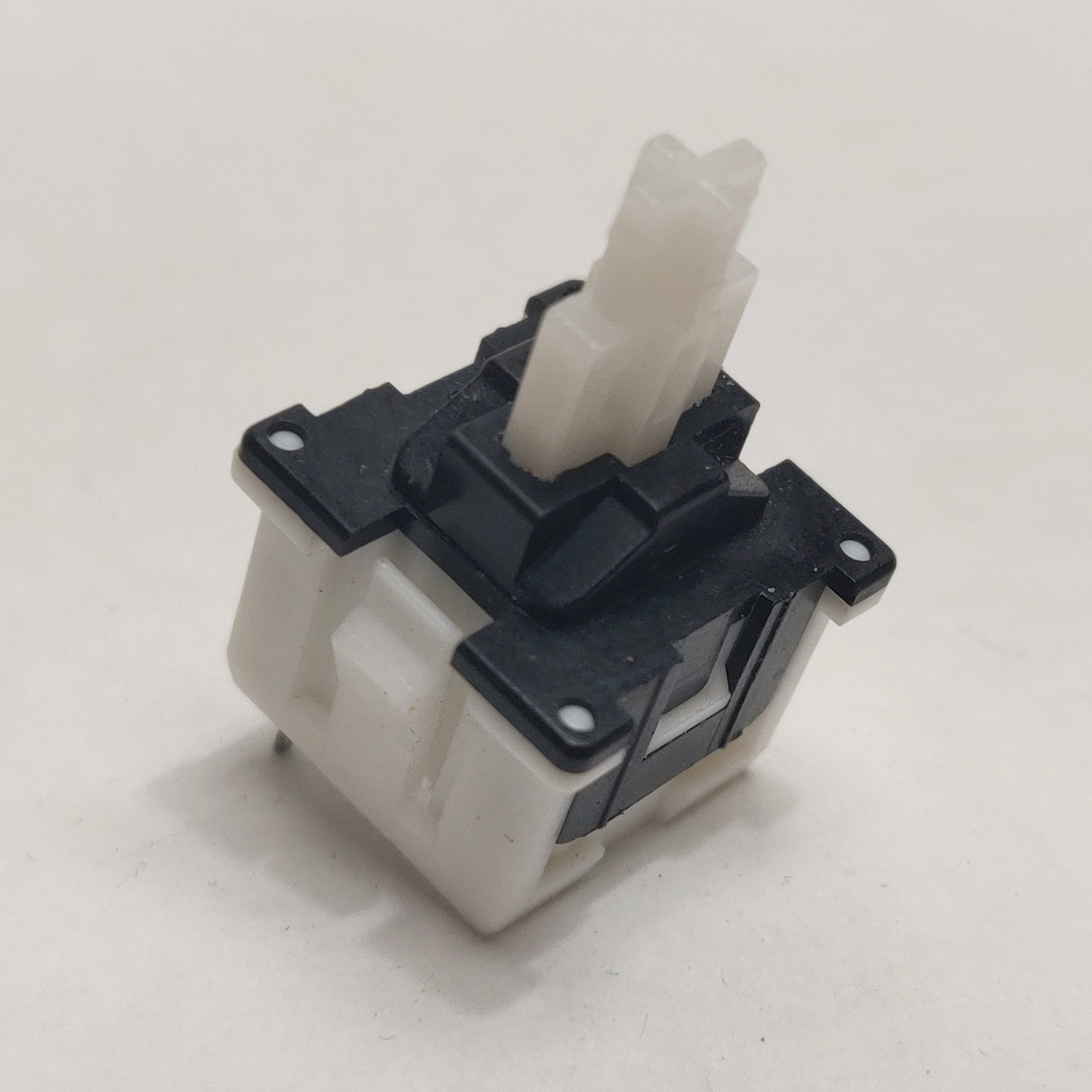 A single desoldered Mitsumi Apple KAM switch