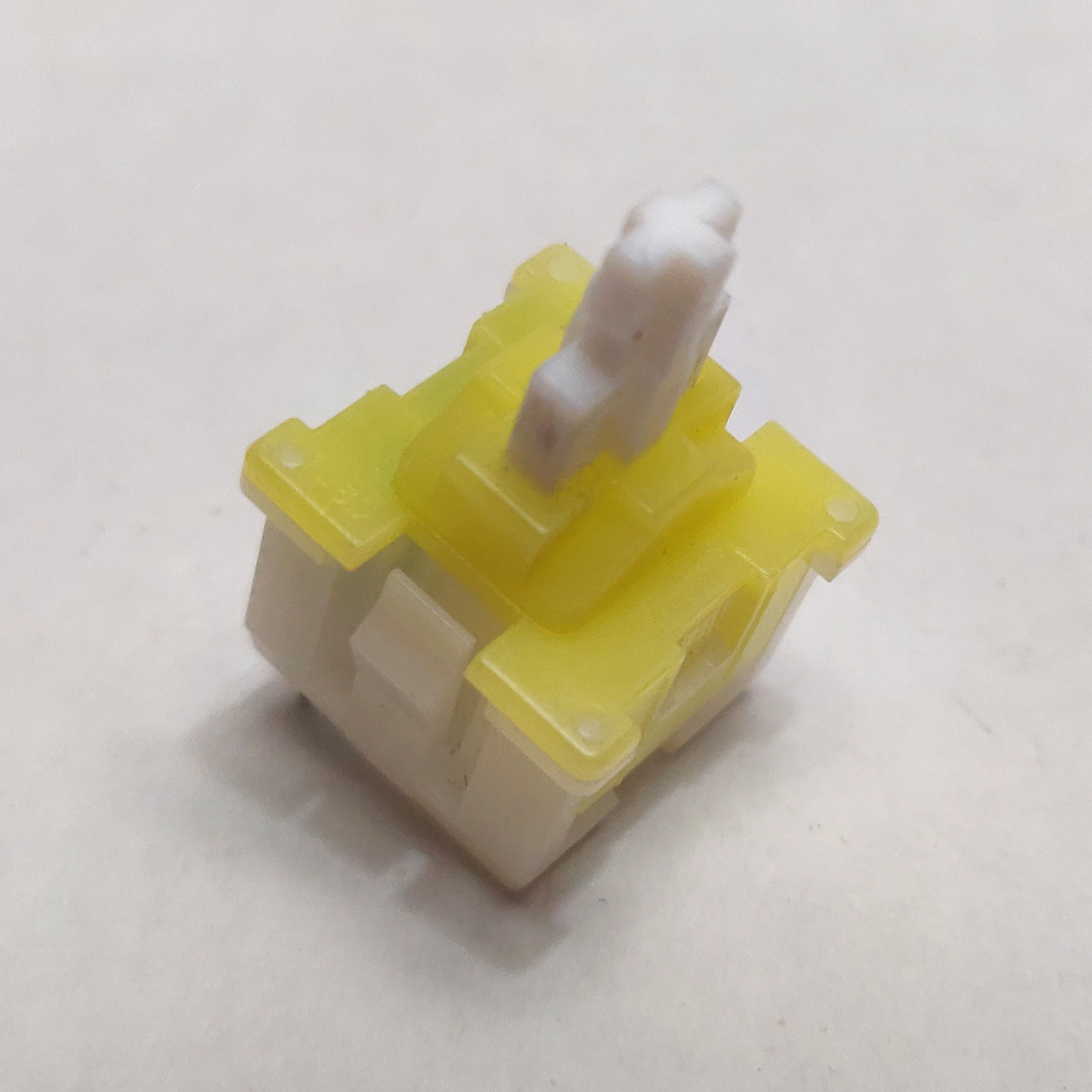 A single desoldered Mitsumi KAM light weight switch