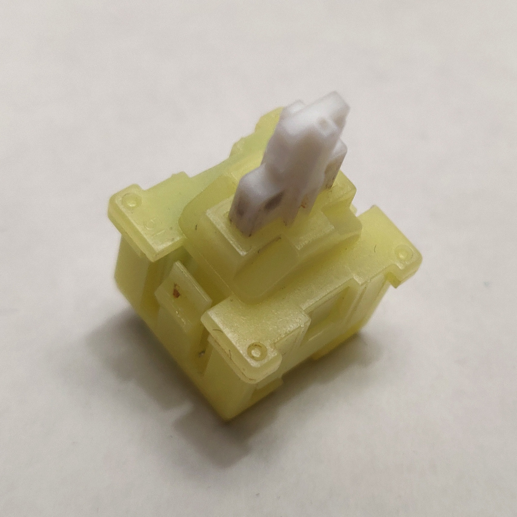 A single desoldered Mitsumi KAM Half Action switch