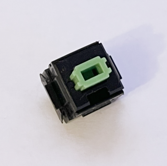 A single desoldered Alps SKCL Green switch