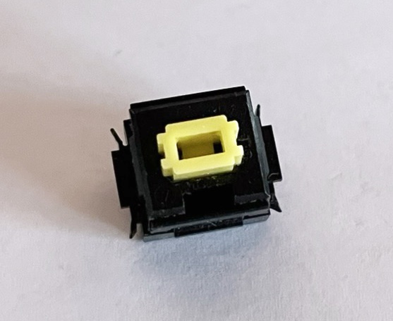 A single desoldered Alps SKCL Yellow switch