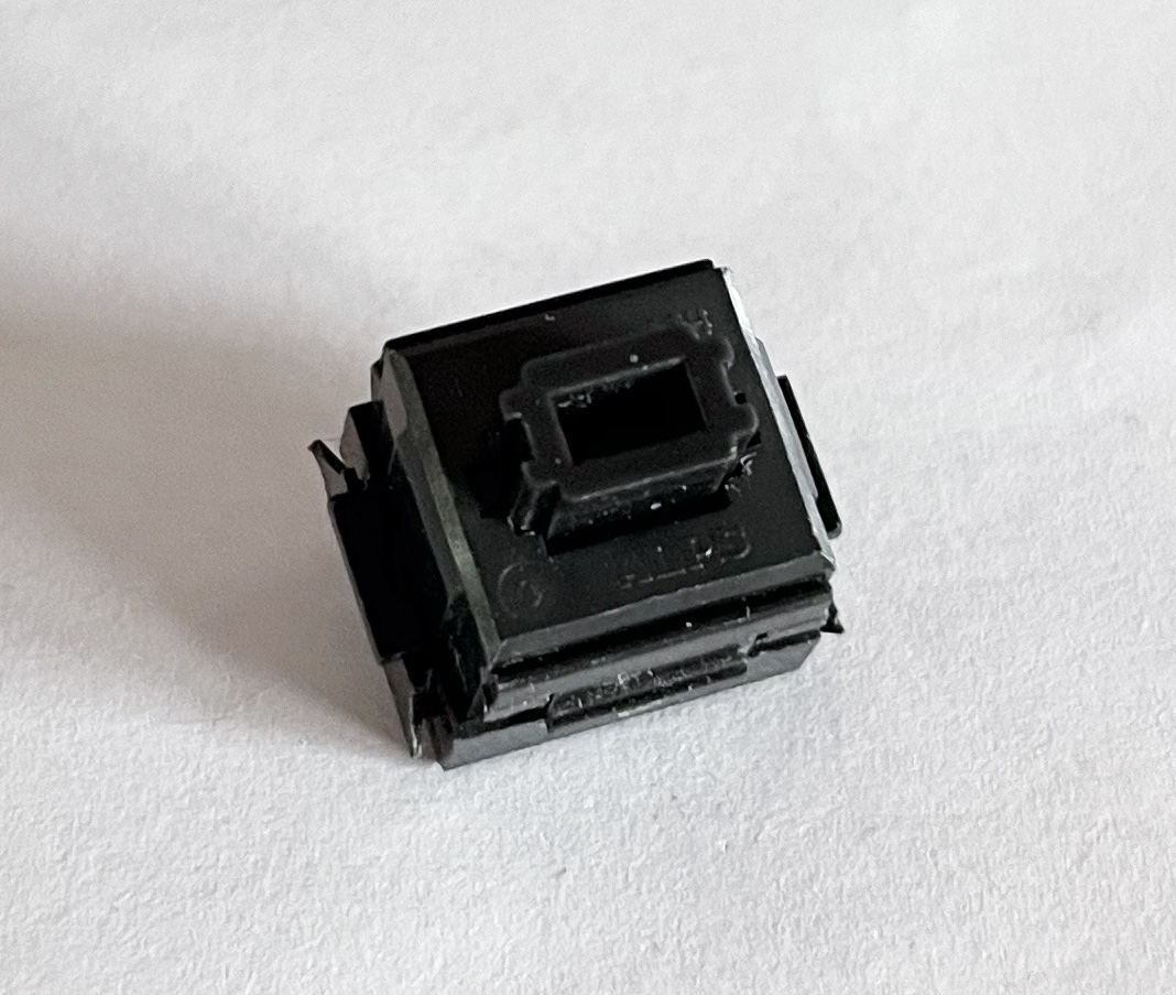 A single desoldered second generation Alps SKCM Black switch